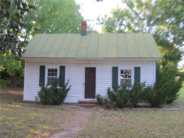 6847 Williams Landing Rd, Hayes, VA 23072 - cape cod house with a standing seam roof, a metal roof, and a chimney