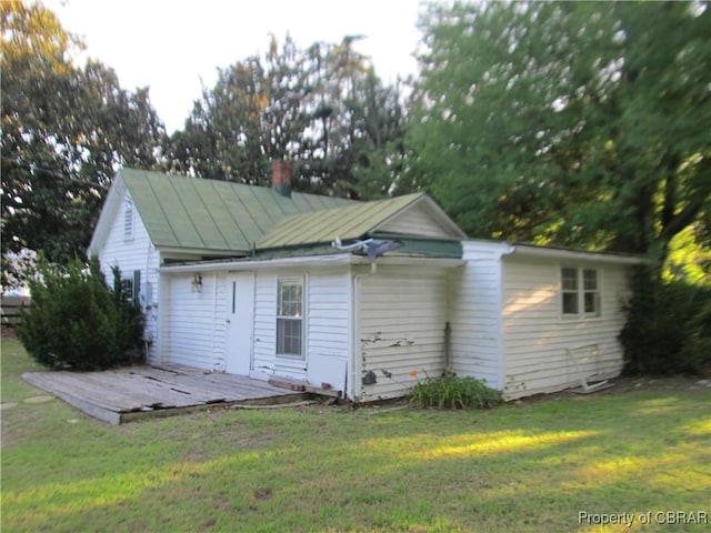 6847 Williams Landing Rd, Hayes, VA 23072 - rear view of property featuring a lawn, a wooden deck, and a chimney