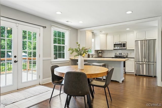 5614 Jahnke Rd, Richmond, VA 23225 - dining area featuring french doors, dark wood-type flooring, and recessed lighting