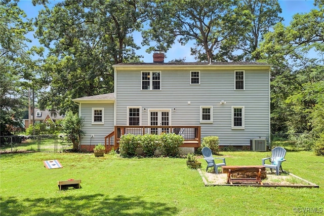 5614 Jahnke Rd, Richmond, VA 23225 - back of property featuring an outdoor fire pit, a wooden deck, a fenced backyard, and a chimney