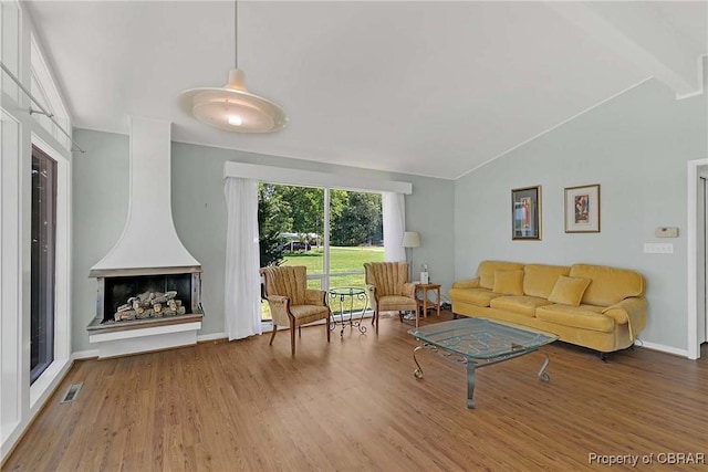 1583 Winona Park Dr, West Point, VA 23181 - living area featuring wood finished floors and vaulted ceiling
