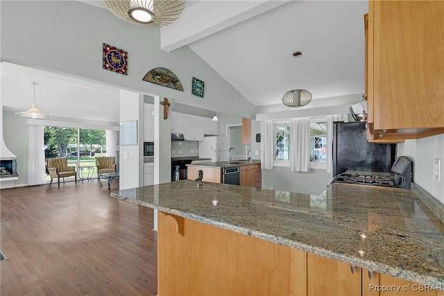 1583 Winona Park Dr, West Point, VA 23181 - kitchen with black appliances, beam ceiling, open floor plan, a peninsula, and plenty of natural light