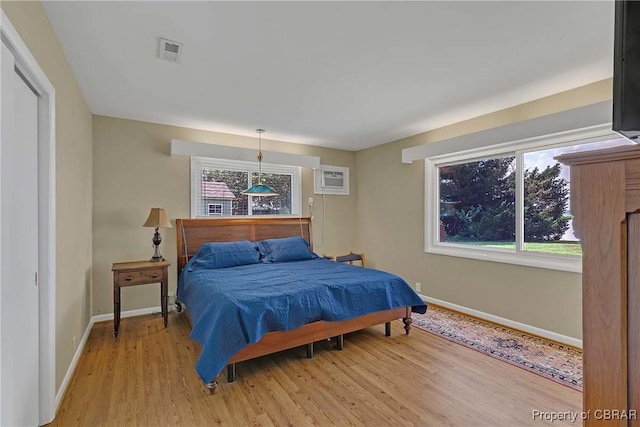 1583 Winona Park Dr, West Point, VA 23181 - bedroom with multiple windows and light wood finished floors