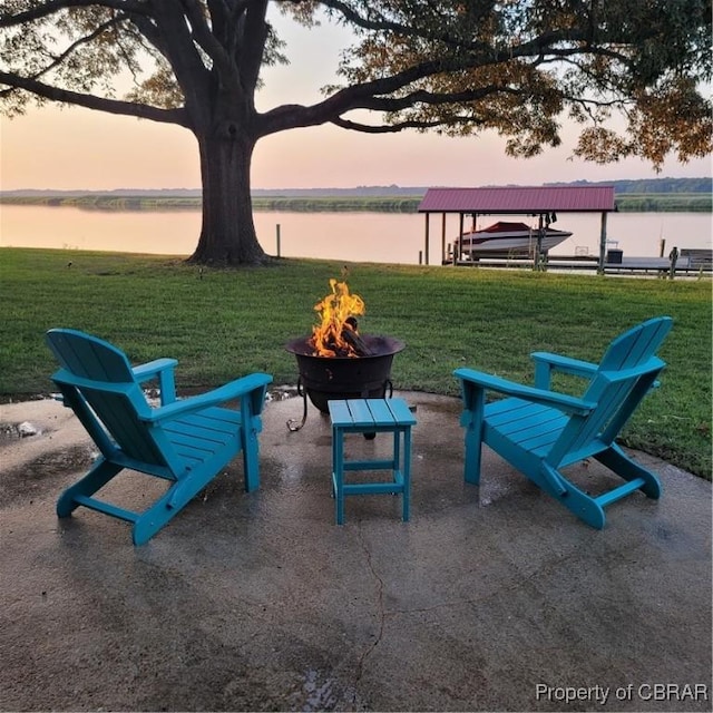 1583 Winona Park Dr, West Point, VA 23181 - view of patio / terrace with a fire pit, a water view, boat lift, and a boat dock