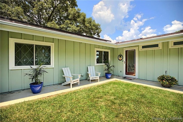 1583 Winona Park Dr, West Point, VA 23181 - entrance to property with board and batten siding and a lawn