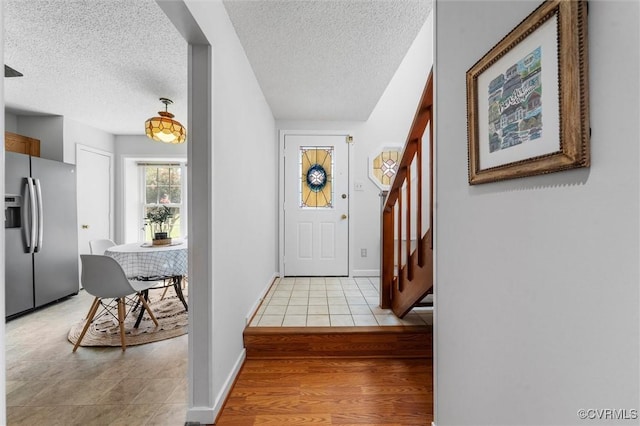 8015 Buford, North Chesterfield, VA 23235 - entryway with stairs, a textured ceiling, and light wood-type flooring