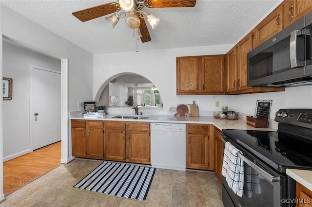 8015 Buford, North Chesterfield, VA 23235 - kitchen featuring electric range, arched walkways, stainless steel microwave, white dishwasher, and a ceiling fan