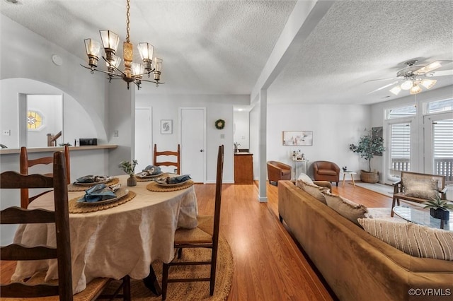 8015 Buford, North Chesterfield, VA 23235 - dining room with a textured ceiling, arched walkways, a ceiling fan, light wood-style flooring, and a chandelier