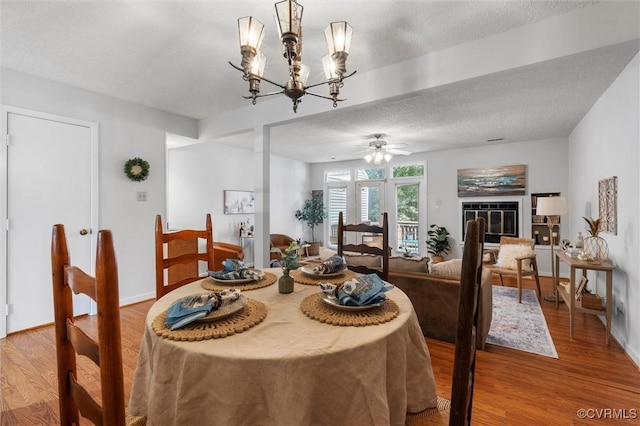 8015 Buford, North Chesterfield, VA 23235 - dining space featuring light wood finished floors, a ceiling fan, a textured ceiling, and a chandelier