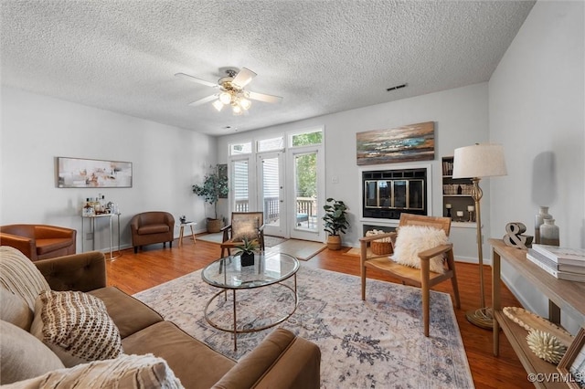 8015 Buford, North Chesterfield, VA 23235 - living room featuring ceiling fan, wood finished floors, and a textured ceiling