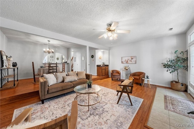 8015 Buford, North Chesterfield, VA 23235 - living area with ceiling fan, light wood-style flooring, a textured ceiling, and a chandelier