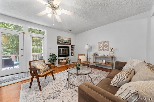 8015 Buford, North Chesterfield, VA 23235 - living area with a textured ceiling, wood finished floors, and a ceiling fan