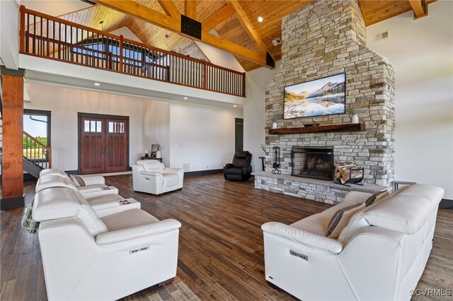 1 Cross County Rd, Mineral, VA 23117 - living room featuring high vaulted ceiling, a wood ceiling with exposed beams, a fireplace, stairs, and wood finished floors