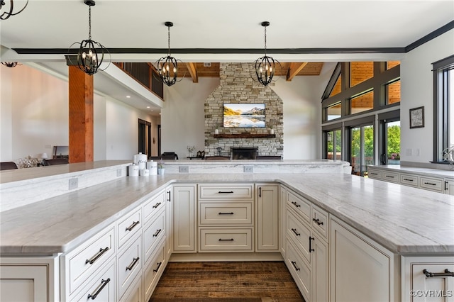 1 Cross County Rd, Mineral, VA 23117 - kitchen with open floor plan, beamed ceiling, a stone fireplace, light stone countertops, and a chandelier