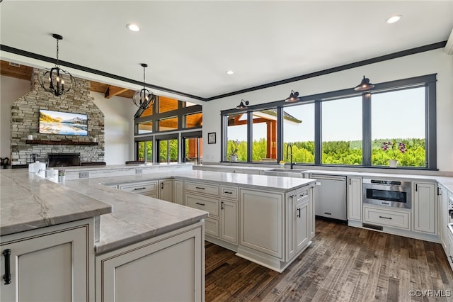 1 Cross County Rd, Mineral, VA 23117 - kitchen featuring dishwasher, dark wood-style flooring, light stone counters, a stone fireplace, and hanging light fixtures