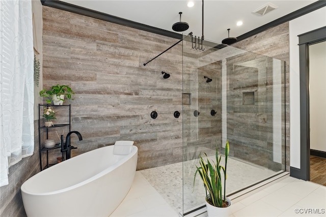 1 Cross County Rd, Mineral, VA 23117 - full bathroom with a shower stall, a freestanding tub, recessed lighting, tile patterned floors, and wood walls