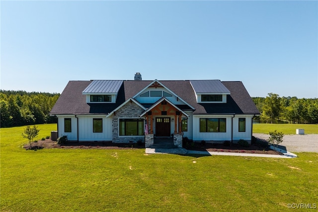1 Cross County Rd, Mineral, VA 23117 - view of front of home featuring a chimney, board and batten siding, and a front lawn