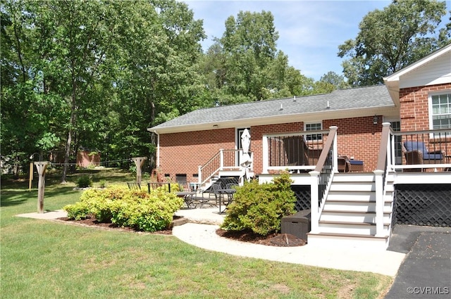 6197 Fishermans Way, Mechanicsville, VA 23116 - rear view of property with brick siding, a yard, stairway, and a deck