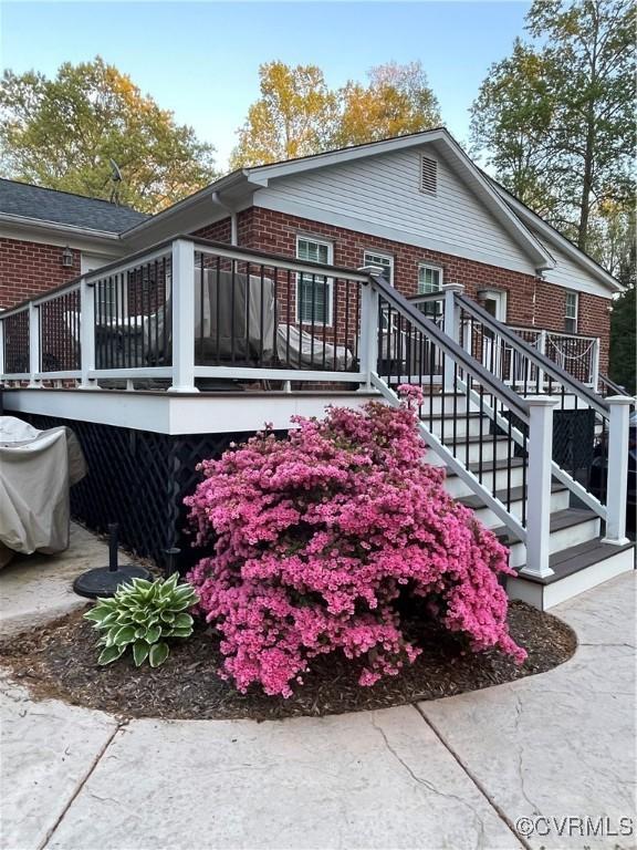 6197 Fishermans Way, Mechanicsville, VA 23116 - view of side of home featuring brick siding, a deck, and stairs