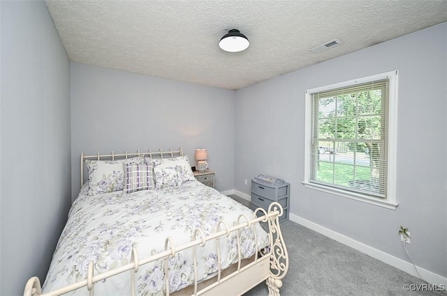 103 N Daisy Ave, Henrico, VA 23075 - carpeted bedroom with baseboards and a textured ceiling