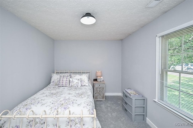 103 N Daisy Ave, Henrico, VA 23075 - carpeted bedroom with baseboards and a textured ceiling