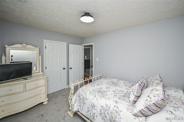 103 N Daisy Ave, Henrico, VA 23075 - carpeted bedroom with a textured ceiling