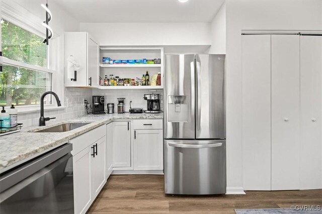 12305 Leesburg Cir, Midlothian, VA 23112 - kitchen featuring appliances with stainless steel finishes, light stone counters, white cabinetry, and decorative backsplash