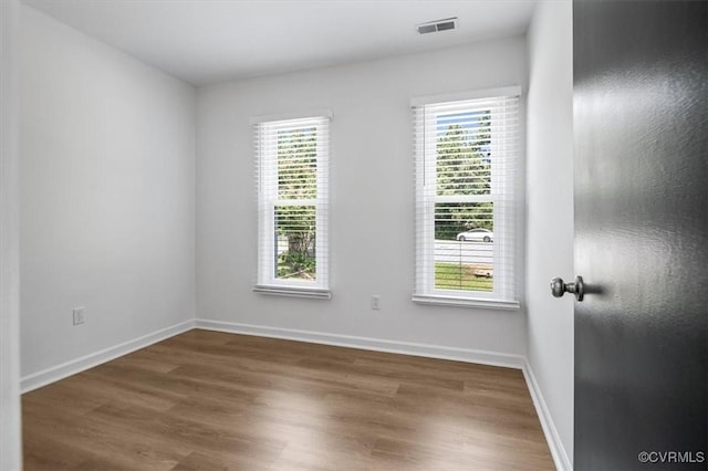 12305 Leesburg Cir, Midlothian, VA 23112 - spare room with healthy amount of natural light and wood finished floors