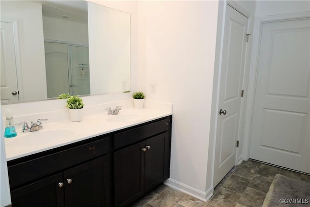 6431 Faulkner Dr, North Chesterfield, VA 23234 - bathroom featuring double vanity, a shower with door, stone finish flooring, and a closet