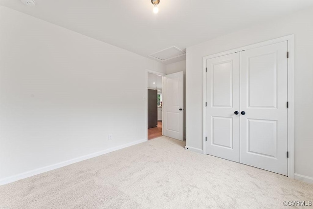 26354 Old Pitts, Ruther Glen, VA 22546 - unfurnished bedroom with carpet, attic access, and a closet