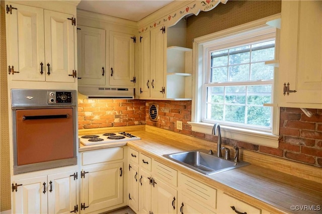 1208 Amesbury Ln, Richmond, VA 23227 - kitchen featuring wall oven, white electric cooktop, light countertops, under cabinet range hood, and open shelves
