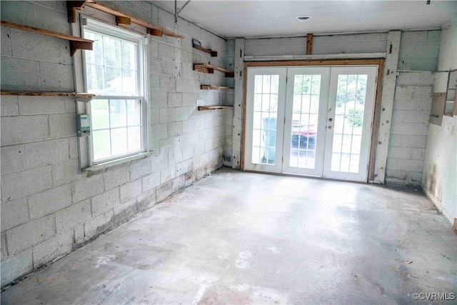 1208 Amesbury Ln, Richmond, VA 23227 - spare room featuring unfinished concrete floors, french doors, and plenty of natural light