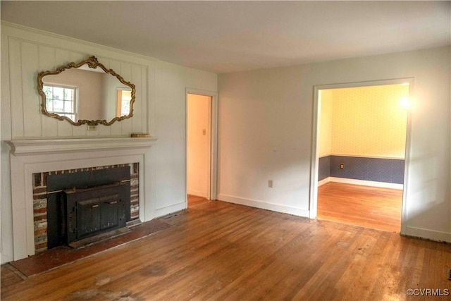 1208 Amesbury Ln, Richmond, VA 23227 - unfurnished living room featuring wood finished floors and a tile fireplace