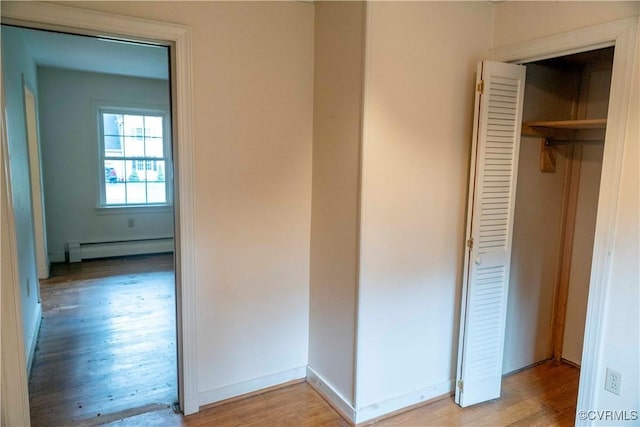 1208 Amesbury Ln, Richmond, VA 23227 - hallway with baseboard heating and light wood finished floors