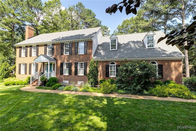 105 Williamson Ct, Henrico, VA 23229 - view of front of home featuring a chimney, brick siding, a front lawn, and a high end roof
