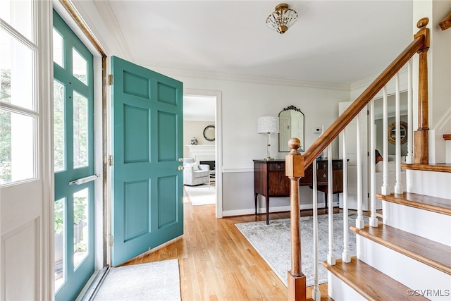 105 Williamson Ct, Henrico, VA 23229 - foyer entrance with stairs, light wood-style flooring, crown molding, and a fireplace