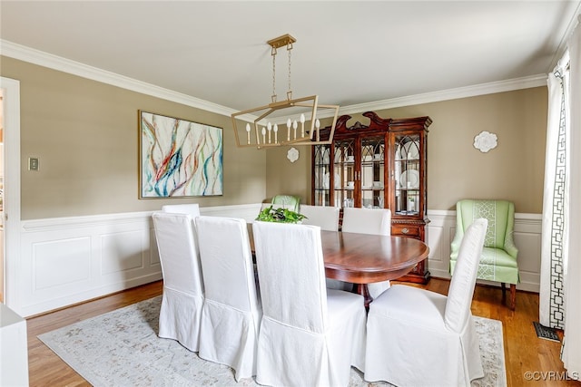 105 Williamson Ct, Henrico, VA 23229 - dining area featuring crown molding, a chandelier, a wainscoted wall, and wood finished floors