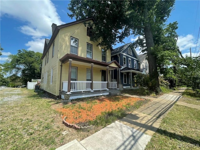 319 W 27th St, Richmond, VA 23225 - view of front facade with a porch