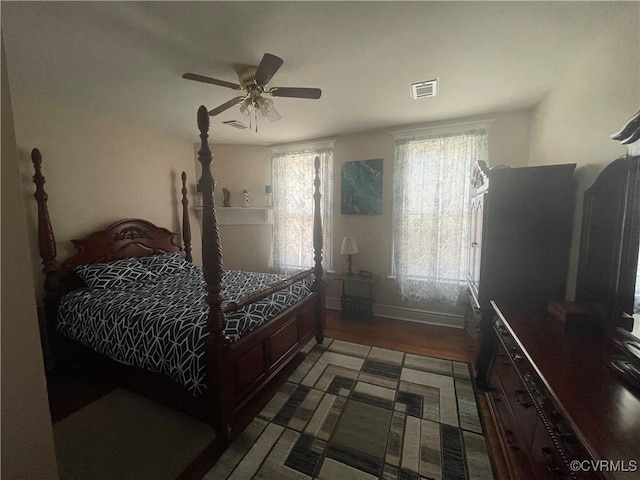 319 W 27th St, Richmond, VA 23225 - bedroom featuring multiple windows, wood finished floors, and a ceiling fan