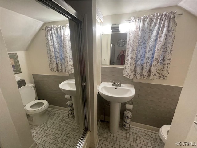 319 W 27th St, Richmond, VA 23225 - bathroom with lofted ceiling and tile patterned flooring