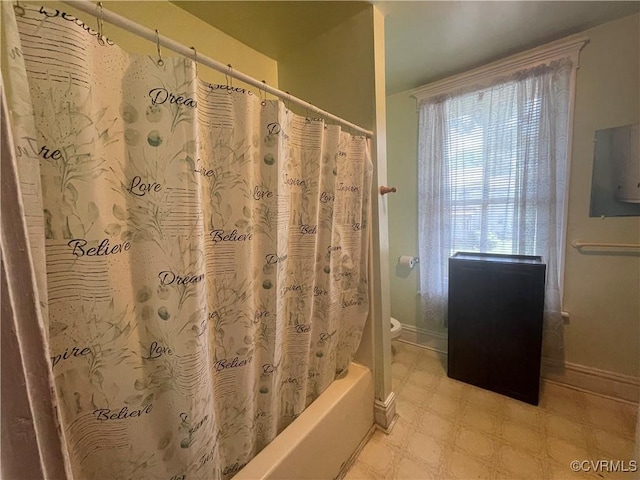 319 W 27th St, Richmond, VA 23225 - bathroom featuring tile patterned floors and shower / bath combination with curtain