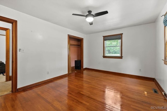3614 Madison St, Prince George, VA 23860 - unfurnished bedroom with wood finished floors, a closet, and a ceiling fan