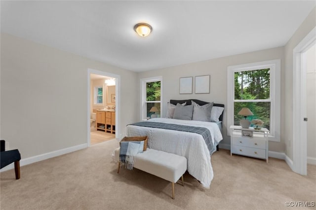 5239 Old Buckingham Rd, Powhatan, VA 23139 - bedroom with multiple windows, light colored carpet, and connected bathroom