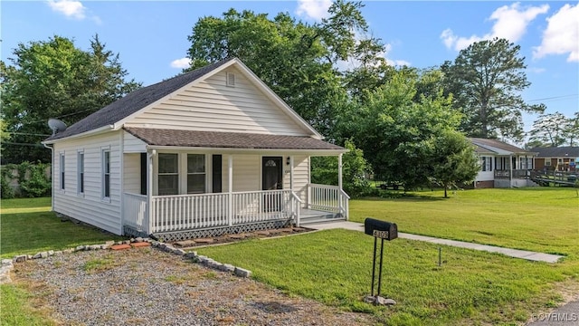 4309 2nd St, Henrico, VA 23223 - view of front of property with a porch, a front yard, and roof with shingles