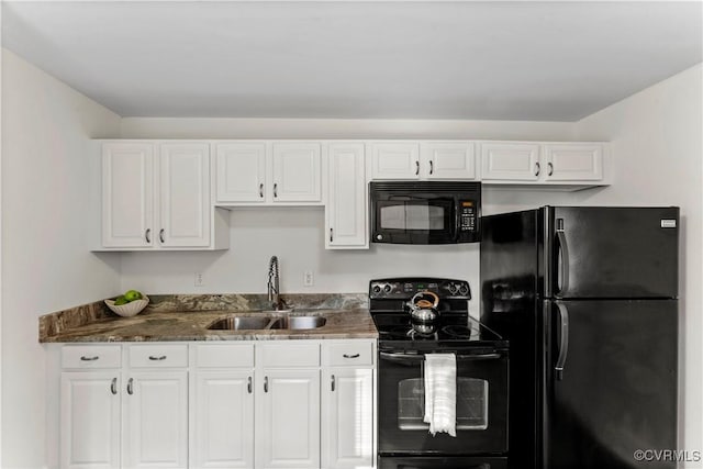 4309 2nd St, Henrico, VA 23223 - kitchen with black appliances, white cabinetry, and dark stone countertops