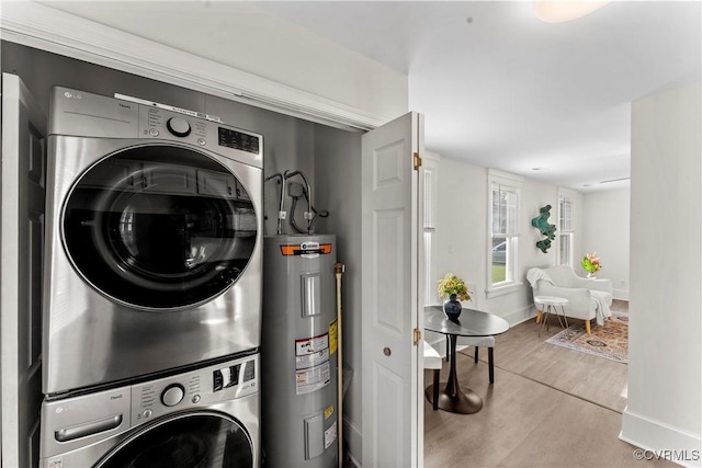 4309 2nd St, Henrico, VA 23223 - laundry room with electric water heater, stacked washer / drying machine, and wood finished floors