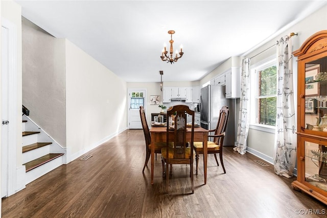 8101 Lake Shore Dr, North Chesterfield, VA 23235 - dining room featuring dark wood finished floors, a chandelier, and stairway