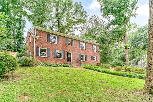 8101 Lake Shore Dr, North Chesterfield, VA 23235 - colonial home featuring brick siding and a front lawn