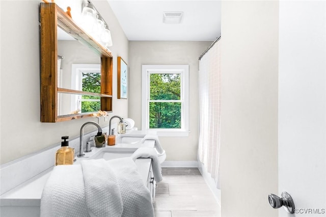 8101 Lake Shore Dr, North Chesterfield, VA 23235 - bathroom with vanity and baseboards