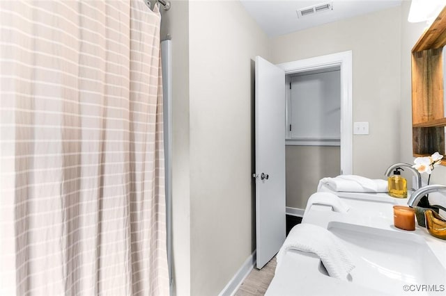 8101 Lake Shore Dr, North Chesterfield, VA 23235 - bathroom featuring wood finished floors and a shower with curtain